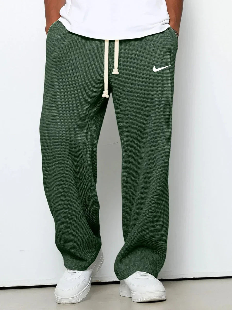 NK™ Pantaloni con trama goffrata