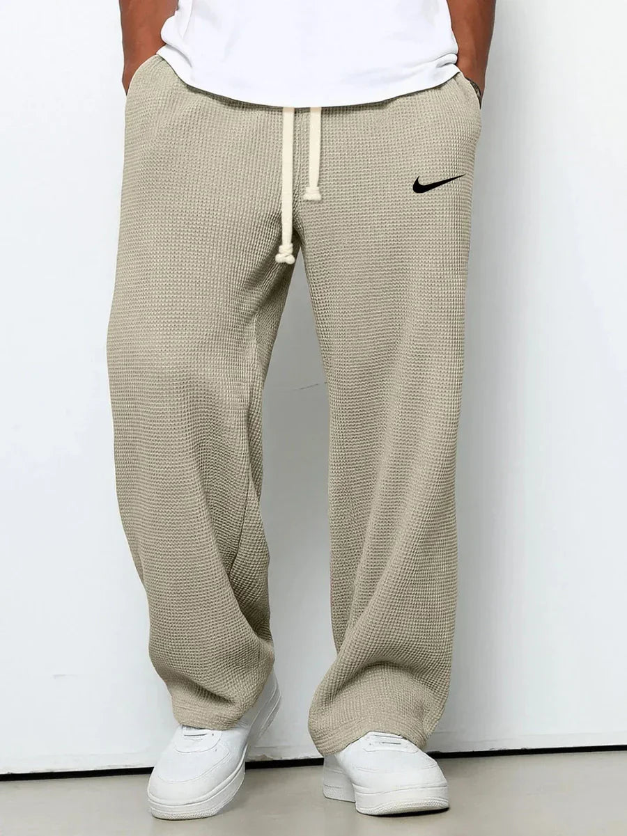 NK™ Pantaloni con trama goffrata