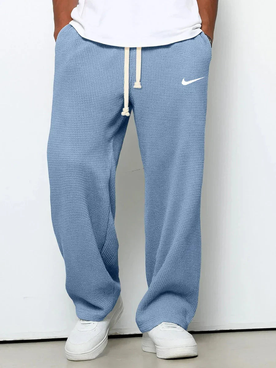 NK™ Pantaloni con trama goffrata