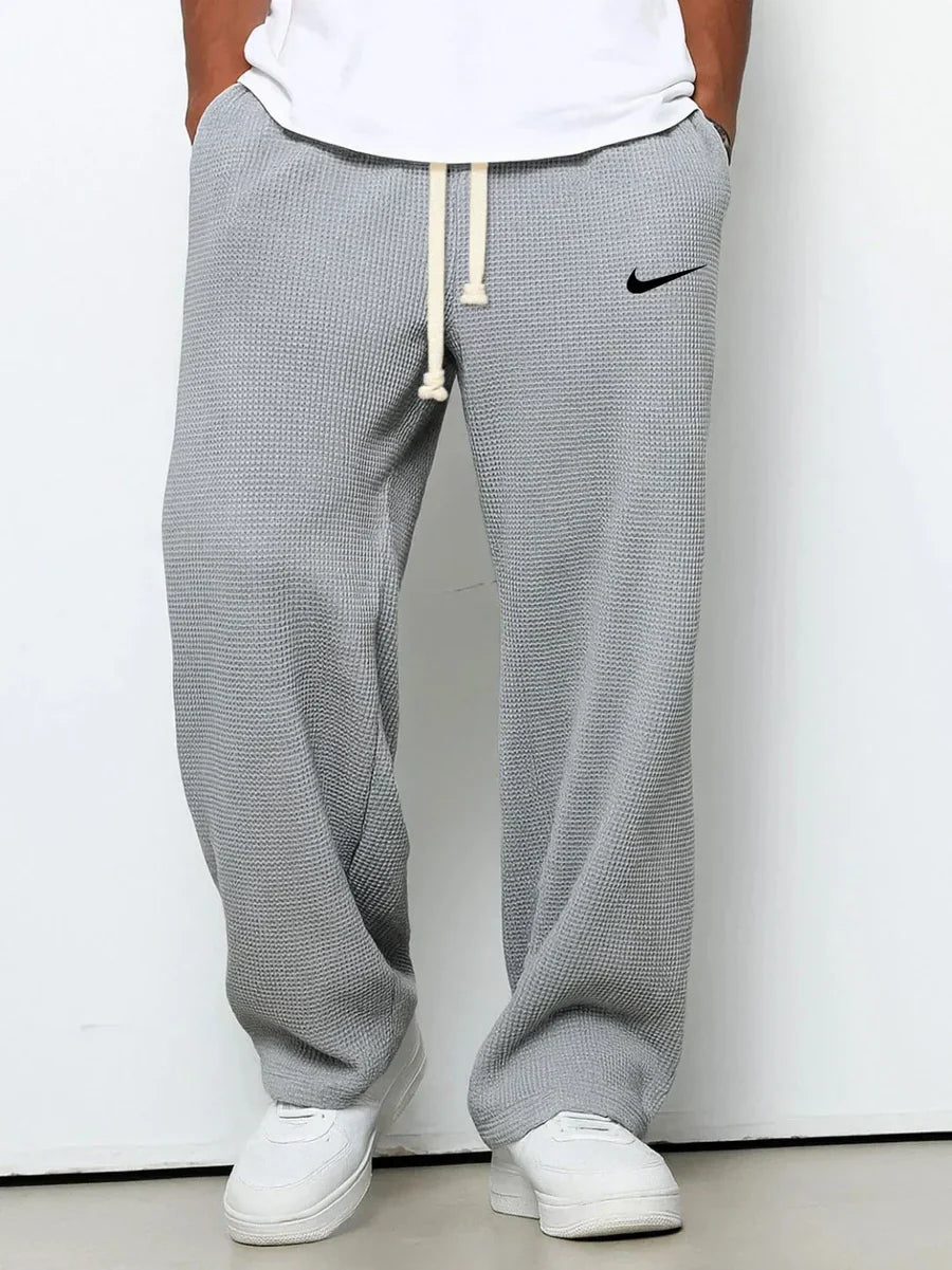 NK™ Pantaloni con trama goffrata