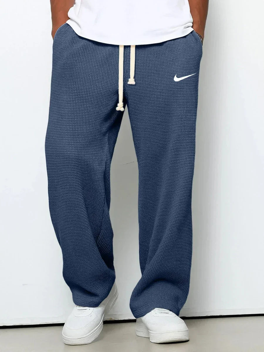 NK™ Pantaloni con trama goffrata
