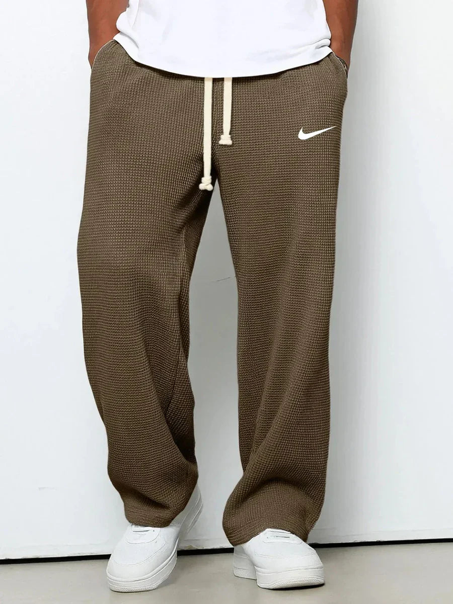 NK™ Pantaloni con trama goffrata