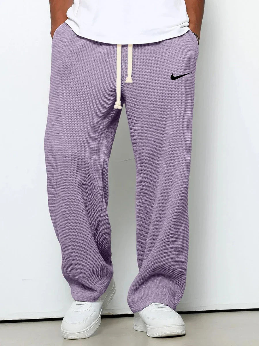 NK™ Pantaloni con trama goffrata